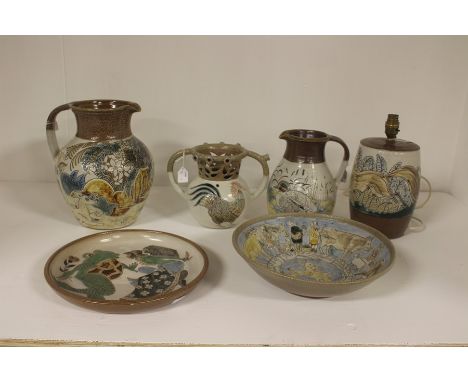 Six pieces of Mosse Ware from Llanbrynmair, comprising dish, large bowl, two jugs, tyg jug and lamp base, all pieces hand pai