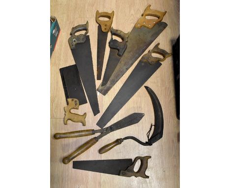 A collection of assorted tools, including Sigh, various saws, sheers etc