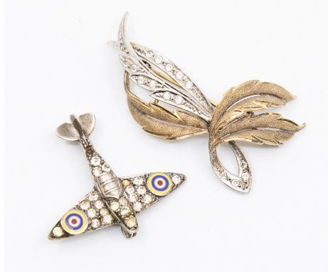 RAF interest- A silver and paste set brooch in the form of a Spitfire airplane, the wings decorated with paste set stones and