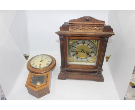 A small oak early 20th Century wall clock along with a late 19th Century mantel clock (2)