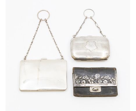 Two George V silver purses, each on suspension chains, one engine turned decoration, fitted interiors, Birmingham, 1913 &amp;