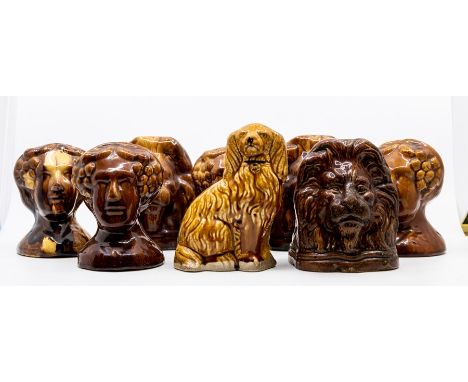 A collection of stone ware sash window stoppers in the shape of ladies and lions heads*** Provenance: from the Estate of the 