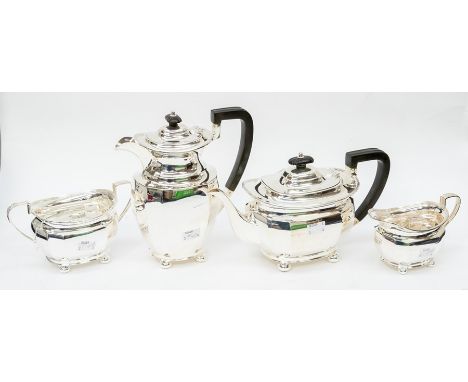 A George V silver matched four piece tea service comprising teapot, sugar bowl, milk jug and hot water jug, Georgian style on