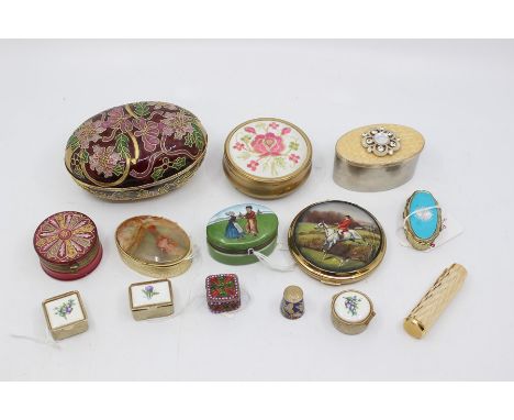 A 19th Century gilt metal mounted circular cranberry glass pill box and cover, the cover decorated with floral motif together