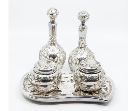 An Art Nouveau glass and Sterling silver overlaid dressing table set, comprising a pair of scent bottles with stoppers, a pai