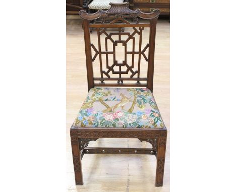 A George III style mahogany carved side chair, in the 'Chippendale Chinoiserie' manner, early 20th Century, the crest rail in