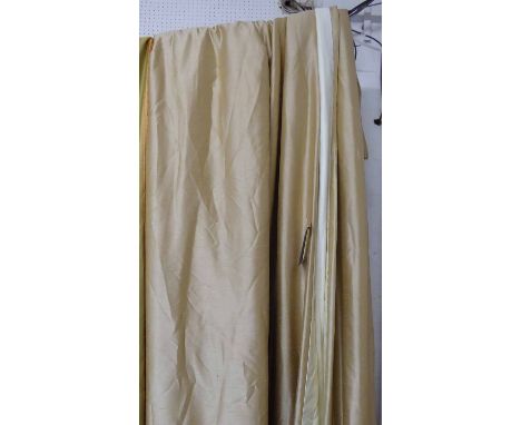 CURTAINS, a pair in gold silk fabric lined and interlined, gathered 114cm W x 267cm Drop.
