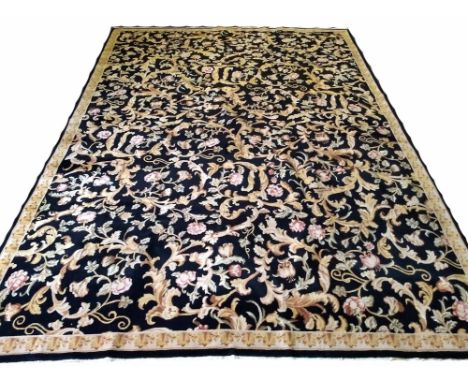 FINE SAVONERIE DESIGN CARPET, 350cm x 258cm, all over spandrel leafs on noir field and gold open leaf border.