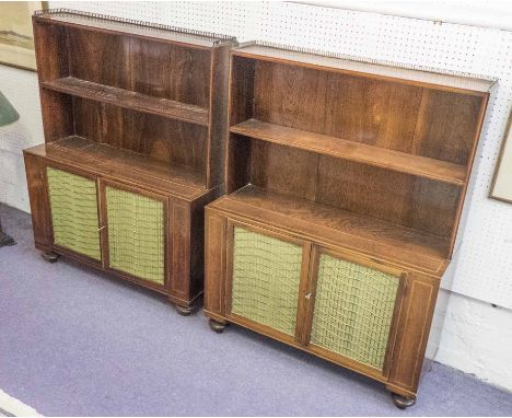 OPEN BOOKCASES, a pair, Regency rosewood and boxwood strung, each with a shelf above two brass grille and green pleated fabri