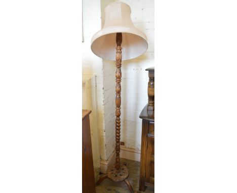 A carved standard lamp