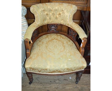 A button back tub chair and a Mahogany yellow upholstered tub chair