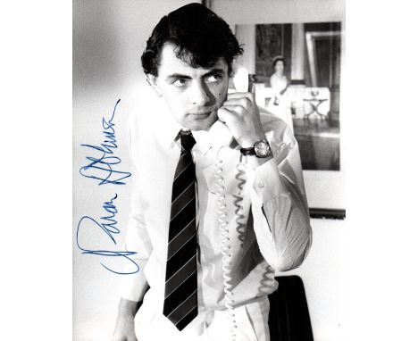 ATKINSON ROWAN: (1955-     ) English Actor & Comedian. Signed 8 x 10 photograph of Atkinson standing in a three quarter lengt
