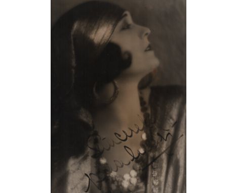 NEGRI POLA: (1897-1987) Polish Actress. A good vintage signed sepia 10.5 x 13.5 photograph of the femme fatale in a profile h