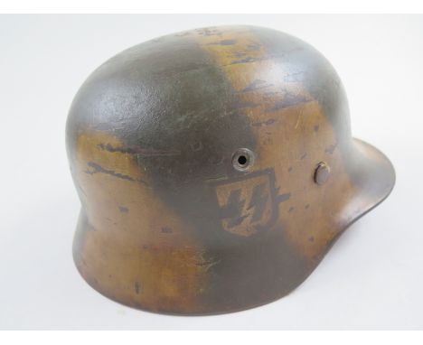 German WWII steel helmet with painted camouflage finish and leather liner SS Runes