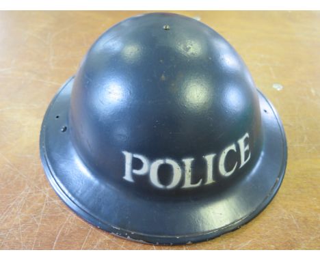 Helmet WW2 home front stencilled on the front polices in excellent condition with liner and chin strap  