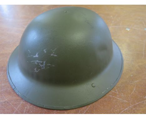 WW1 British Brodie helmet complete with lining and chin strap possibly been repainted ?  