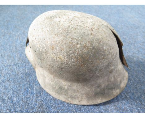 German excavated raw edge tin helmet, possibly run over by a tank, but squashed, sold a/f