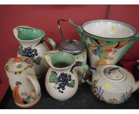 Royal Venton Art Deco vase, two Carlton jugs, Ridgways teapot, coronet biscuit barrel, and a Arthur Wood lidded jar. Conditio