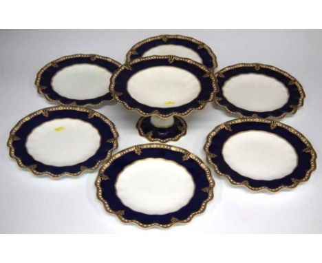 Royal Crown Derby part dessert set comprising of six plates and a comport with jewelled navy blue borders, Condition report: 