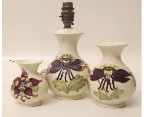Moorcroft lamp and two matching vases Condition report: see terms and conditions.
