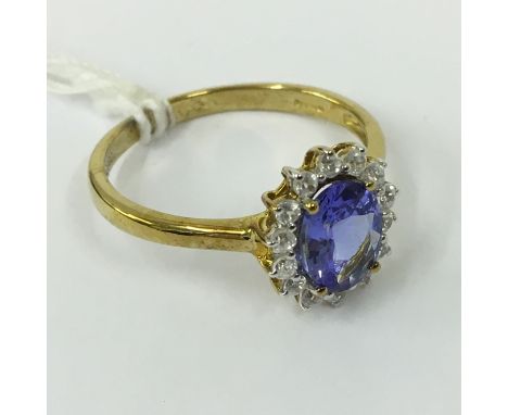 9CT GOLD TANZANITE & WHITE TOPAZ RING - SIZE Q - R