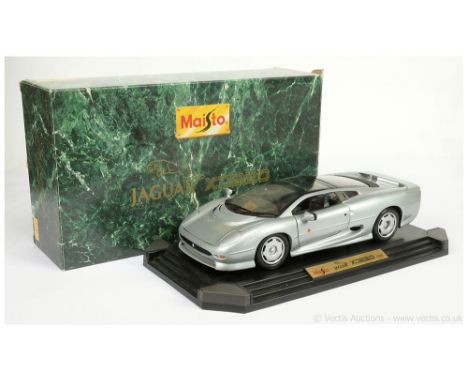 Maisto 33201 1/12th scale 1992 Jaguar XJ220 - metallic silver, dark grey interior, mounted on stepped plastic plinth - genera