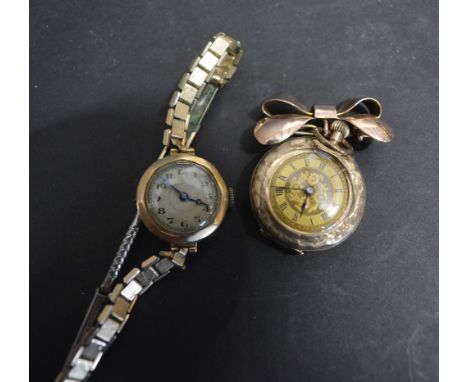 A 9ct. Gold Cased Ladies' Fob Watch with Bow Brooch Attachment, together with a 9ct. gold cased ladies' wrist watch