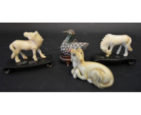 A Late 19th Early 20th Century Chinese Carved Ivory Netsuke together with a similar pair of horses with hardwood stands and a