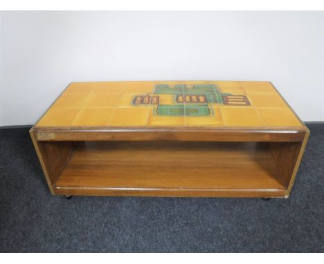 A 1970's teak two tier tile topped coffee table 