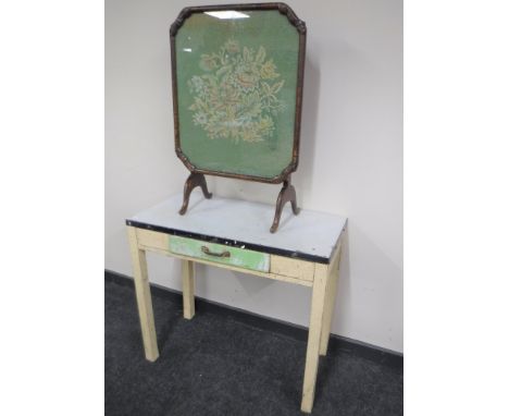 A mid 20th century kitchen table fitted a drawer and a tapestry table screen 