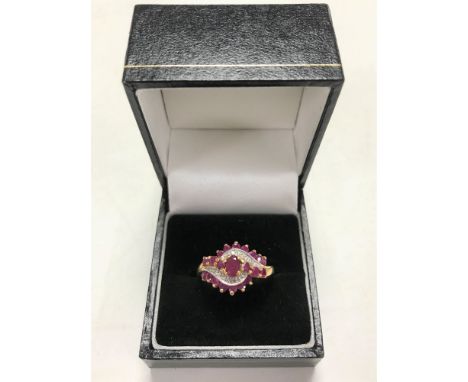 A 9ct gold synthetic ruby and diamond set dress ring, size P/Q.