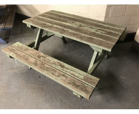 A fixed position wooden table and bench set, width 150cm