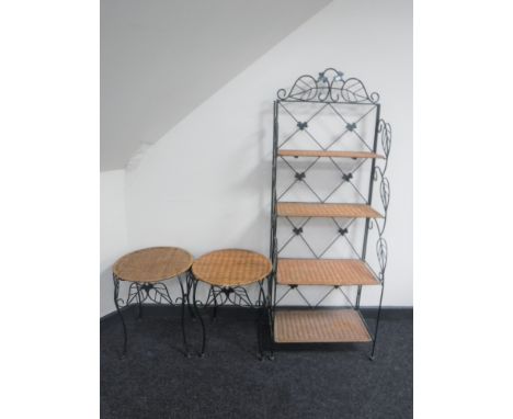 A metal and wicker four tier standing shelf, together with a pair of circular metal and wicker occasional tables  