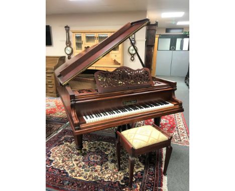 A mahogany cased boudoir grand piano by Gebruder Knake, Munster, width 153 cm, length 212 cm, together with storage piano sto