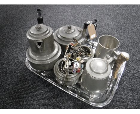 A tray of four piece hammered pewter tea service on tray, collector's spoons, pewter tankard etc