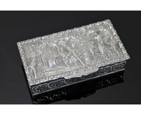 A Dutch silver snuff box, cast in relief with figures in a rural setting, with gilt interior