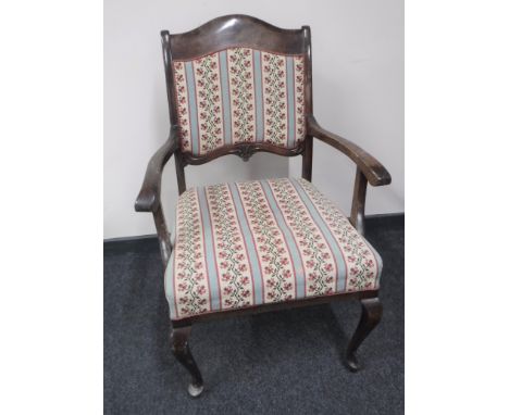 An early twentieth century mahogany armchair, upholstered in a tapestry covering  