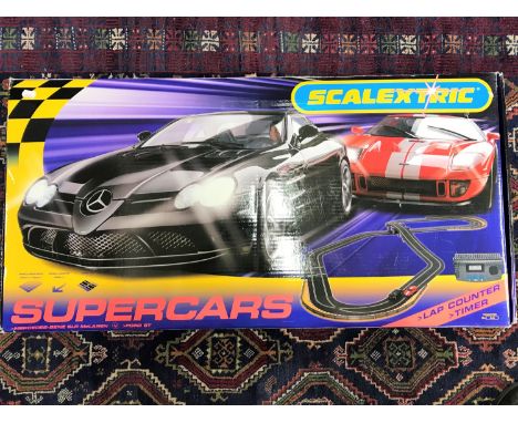 A boxed Scalextric Supercars set