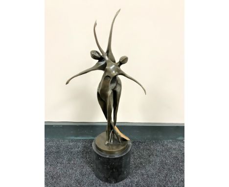 An Art Deco style bronze figure of two female dancers, on marble base, height 59cm