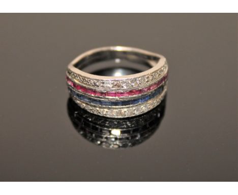 A diamond, sapphire and ruby half eternity ring, two rows of baguette-cut rubies and sapphires within borders of old-cut diam