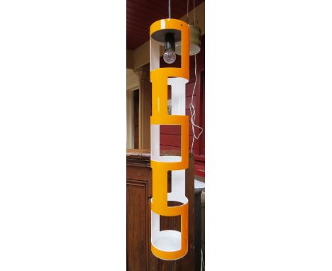 An orange and white plastic pendant ceiling light 