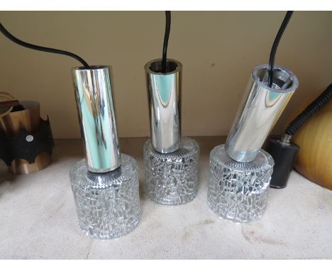 A 1960's ceiling light with three clear textured glass pendant shades