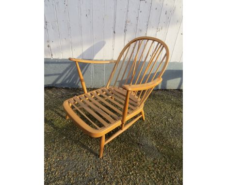 An Ercol light elm lounge chair 
