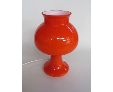 A cased orange glass table lamp 