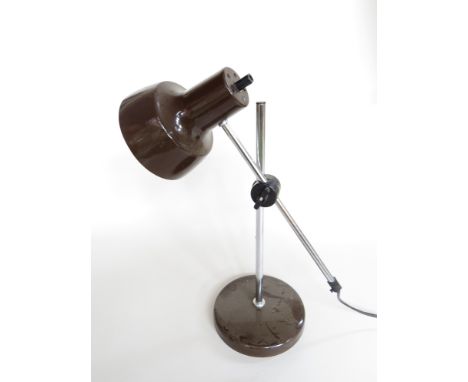 A brown and chrome adjustable desk lamp 