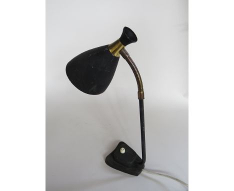 A 1950s adjustable desk lamp with a black conical shade 