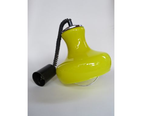 A yellow glass push pull ceiling light 