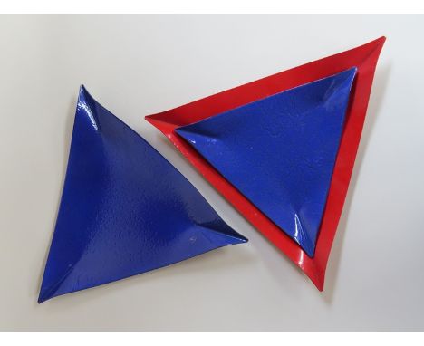 Three triangular enamel dishes 