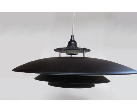 A black four tier ceiling light in the style of Louis Poulsen