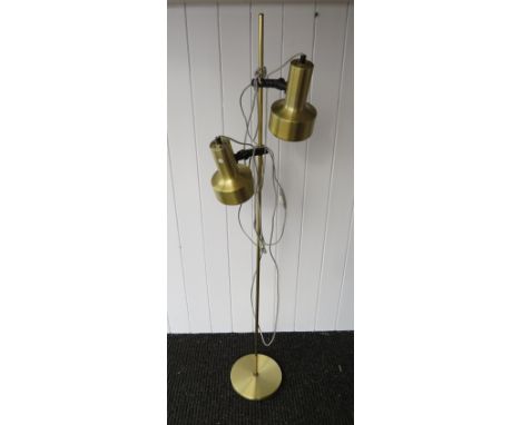 A brassed standard lamp with twin adjustable spots 